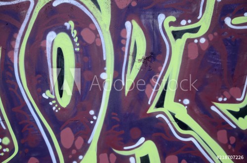 Image de Fragment of graffiti drawings The old wall decorated with paint stains in the style of street art culture Colored background texture